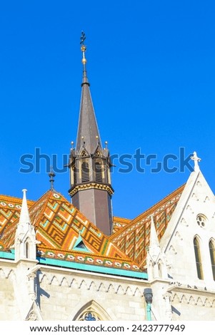 Richly decorated Matthias Church turrets Roman Catholic church ,Budapest, Hungary, in front of the Fisherman s Bastion at the heart of Buda s Castle District,December 17th 2014