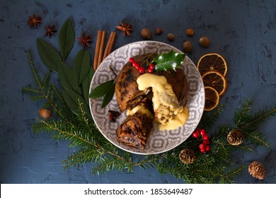 Richly Spiced Christmas Pudding Cake With Custard. Christmas And New Year Table, Decorations. View From Above, Top Studio Shot