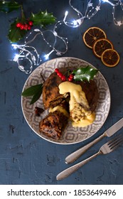 Richly Spiced Christmas Pudding Cake With Custard. Christmas And New Year Table, Decorations. View From Above, Top Studio Shot