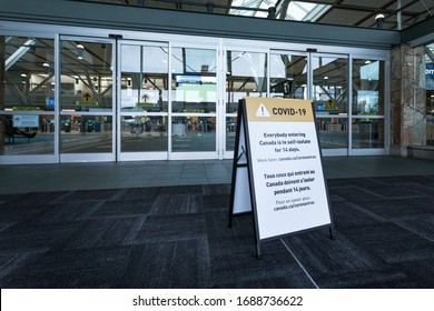 RICHMOND, BC, CANADA - MAR 29, 2020: A Public Health Notice Sign At YVR Advising Returning Travellers In Light Of The COVID-19 Coronavirus Pandemic.