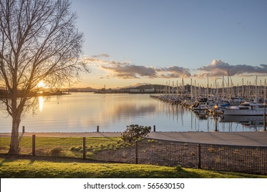 Richmond, CA - JAN 24, 2017: Bay water view of sunset in Richmond California with Habor and boats. The city was incorporated on August 7, 1905.