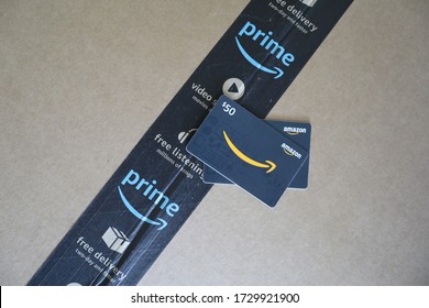 Richmond Hill, Georgia/United States-May 12 2020:Close Up Of Amazon Box With Seal And Amazon Gift Card On Top.Amazon.com Inc Is An American Multinational Technology Company Based In Seattle.