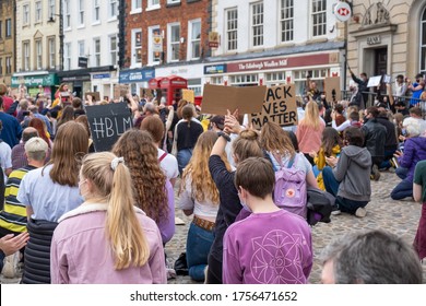 Richmond, North Yorkshire, UK - June 14, 2020: A Group Of Protesters Kneeling At A Black Lives Matter Protest In Richmond, North Yorkshire