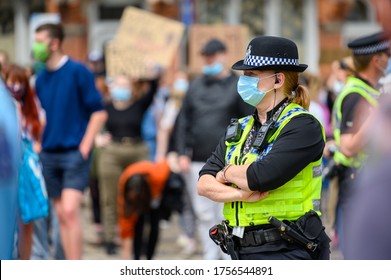 Richmond, North Yorkshire, UK - June 14, 2020: A Female Police Officer Wears A PPE Face Mask At A Black Lives Matter Protest