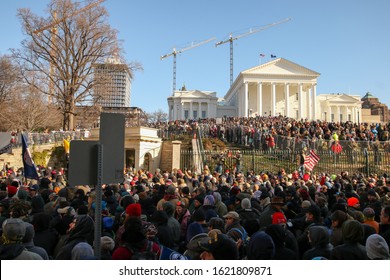 Richmond, Virginia USA / January 20, 2020 : Pro Second Amendment Gun Rights Rally on the grounds of the Virginia State Capitol with crowds of people protesting the new gun laws