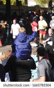 Richmond, Virginia / USA - Oct 26,2010: Kid And Crowd Cheering Runners On At Richmond Marathon.