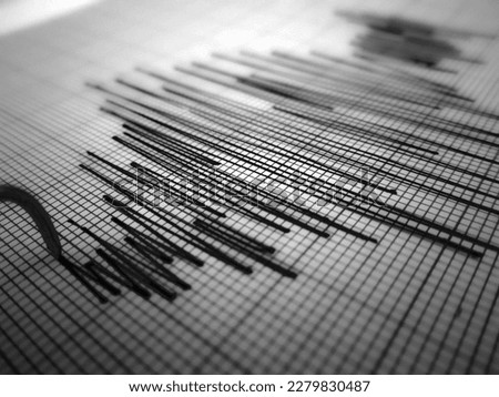                   Richter scale Low and High Earthquake Waves vibrating on white paper background, sound wave diagram concept                       