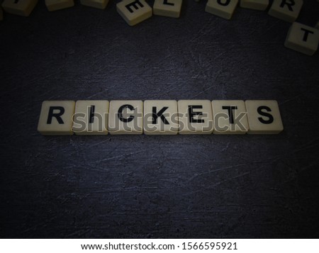 Rickets, word cube with background.