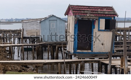 Rickety sheds on a wooden dock