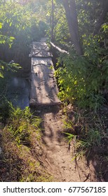 Rickety Wooden Bridge Across The River