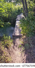 Rickety Wooden Bridge Across The River