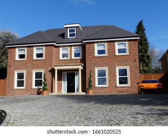Rickmansworth, Hertfordshire, England, UK - March 2nd 2020: Modern Single-family Brick Detached Property With Sports Car Outside In The Drive, Rickmansworth