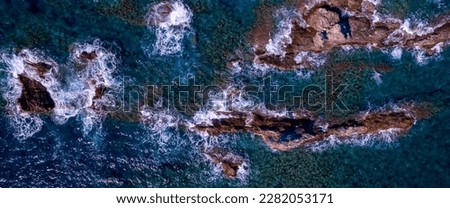 Similar – Aerial Drone View Of Dramatic Ocean Waves Crushing On Rocky Landscape