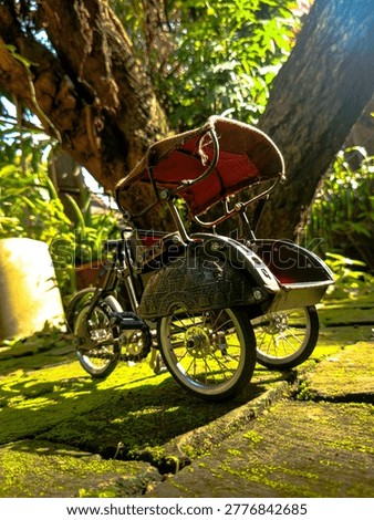 a rickshaw with the background of a park