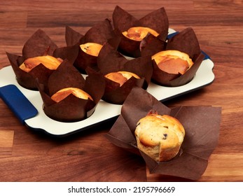 Ricotta And Blueberry Muffins In A Gray Muffin Tray.