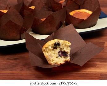 Ricotta And Blueberry Muffins In A Gray Muffin Tray.