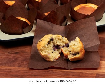 Ricotta And Blueberry Muffins In A Gray Muffin Tray.