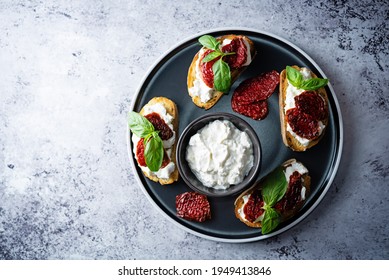 Ricotta Dried Tomato Basil Bruschetta. Toning. Selective Focus