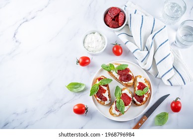 Ricotta Dried Tomato Basil Bruschetta. Toning. Selective Focus