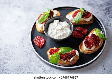 Ricotta Dried Tomato Basil Bruschetta. Toning. Selective Focus