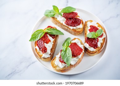 Ricotta Dried Tomato Basil Bruschetta. Toning. Selective Focus