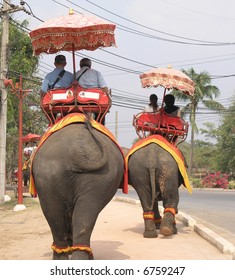  ridding  elephants thailand