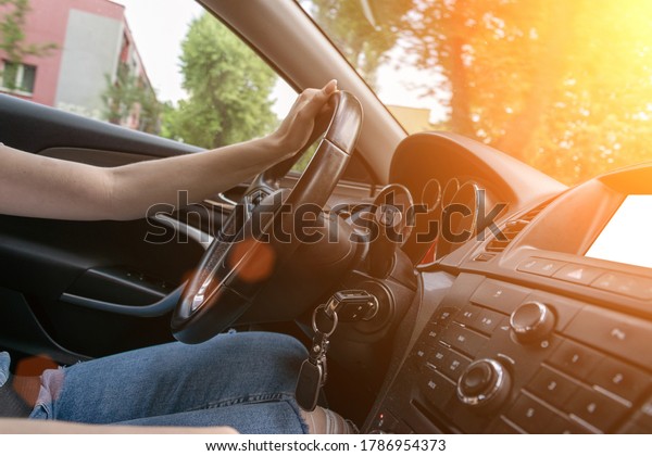 Ride car. Young happy woman have travel trip on\
road. Fun driver in summer vacation ride concept. Drive inside auto\
in sunny day.