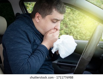A ride during a car trip. The driver suffers from kinetosis, motion sickness. The concept of motion sickness in transport and vestibular apparatus disease