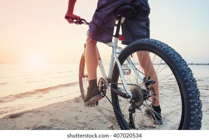 Ride On Bike On The Beach. Sport And Active Life Concept
