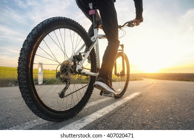 Ride on bike on the road. Sport and active life concept in the summer time