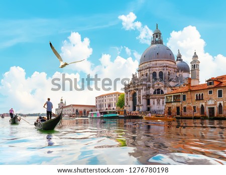 Ride on gondolas along the Gand Canal in Venice, Italy