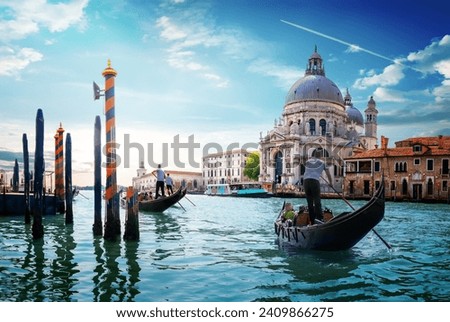 Ride on gondolas along the Gand Canal in Venice, Italy