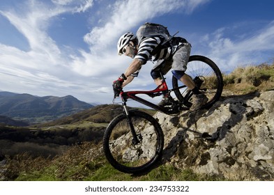 Rider in action at Freestyle Mountain Bike Session - Powered by Shutterstock