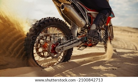 Rider driving in motocross race skid wheel