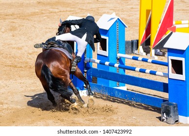 rider has an accident when falling off the horse before attempting to jump an obstacle in an equestrian competition, series of four photos - Powered by Shutterstock