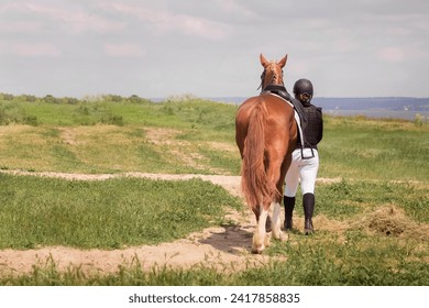 rider leads horse, equestrian competition, rear view, copy space

 - Powered by Shutterstock