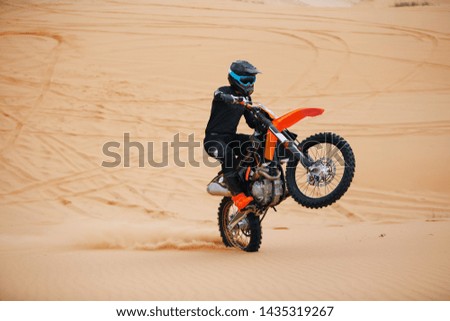 Rider on endure motorcycle at the desert
