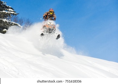 Rider On The Snowmobile In The Mountains Ski Resort In Sakhalin Island Russia.