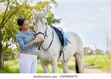 Rider, woman and bonding with horse in countryside for companion, training and relax from practice in forest. Equestrian, person and stallion outdoor with pet care, smile and agriculture in nature - Powered by Shutterstock