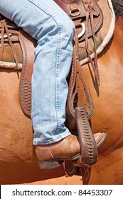 Rider's Foot In Stirrup In A Western Saddle