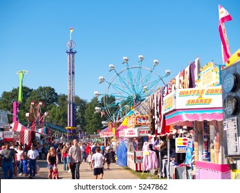 Rides, concessions, and crowds at a county fair