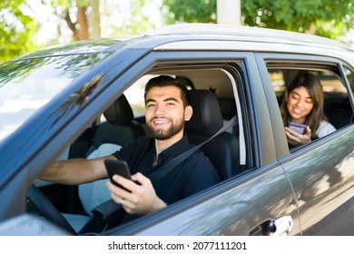 Rideshare Driver And Female Passenger Riding While Using The Gps Map On The Smartphone App 