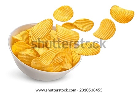 Ridged potato chips in bowl isolated on white background