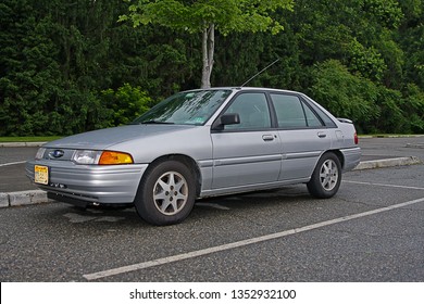 RIDGEWOOD, NEW JERSEY - JUNE 13, 2013: A 1996 Ford Escort In A Local Parking Lot. The Escort Was Ford's First Front-wheel-drive Car Built In North America Effectively Replacing The Smaller Fiesta.