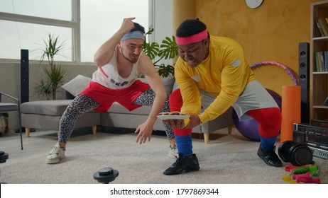 Ridiculous Amazing Multi-ethnic Weak Men Lifting Plate With Cookies. Weird Fitness Comical Guys Lifting Weights Playing Freaks On Workout Home Training.