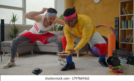 Ridiculous Amazing Multi-ethnic Weak Men Lifting Plate With Cookies. Weird Fitness Comical Guys Lifting Weights Playing Freaks On Workout Home Training.