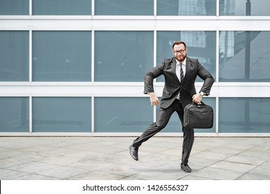 Ridiculous Business Man In A Suit And Glasses Dancing In The Street