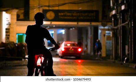 Riding Bicycle At Night In Bangkok