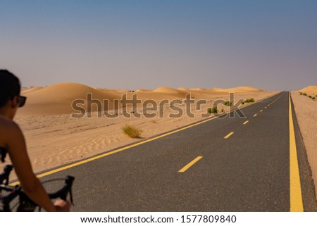 Riding bicycle through the desert 
