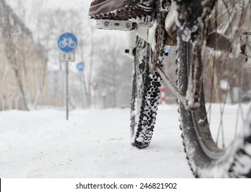 Riding A Bicycle In Winter Over Snow